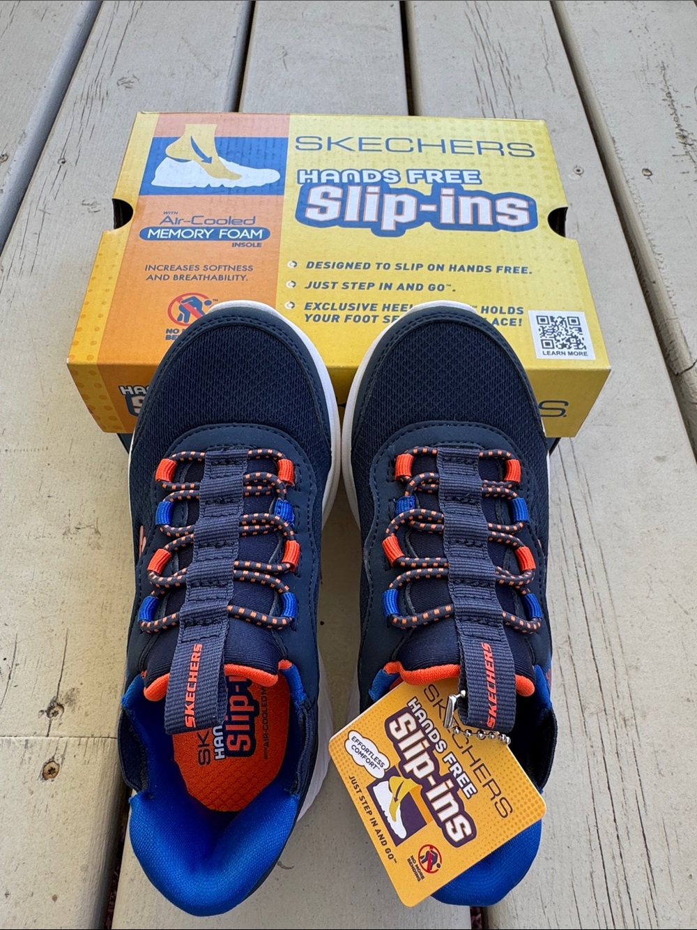 Skechers Kids Navy Slip-On Sneakers with Orange and Blue Accents